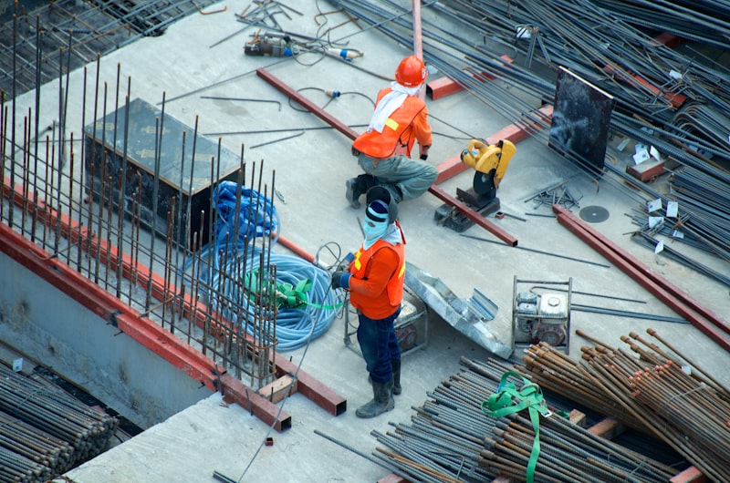 AdolphCoors Construction team reviewing building plans on a commercial construction site